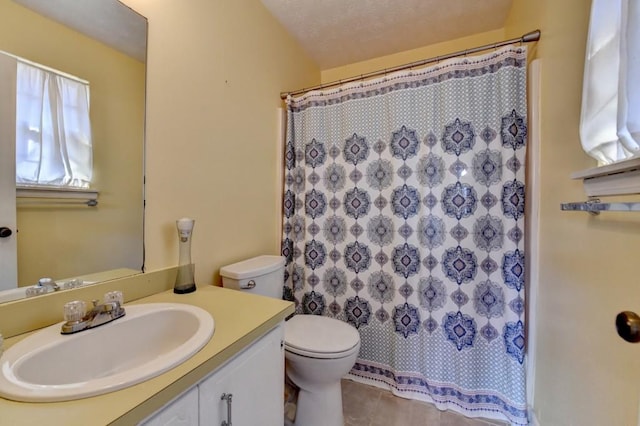 bathroom featuring a shower with shower curtain, toilet, tile patterned flooring, a textured ceiling, and vanity