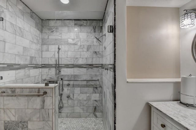 full bath with a stall shower and vanity