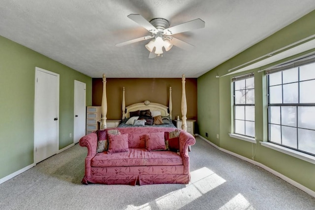 bedroom featuring carpet flooring, a ceiling fan, and baseboards