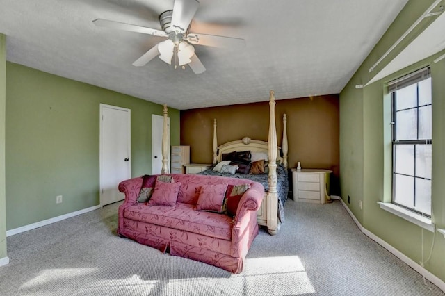 bedroom featuring carpet floors, multiple windows, and baseboards