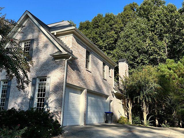 view of side of property with a garage