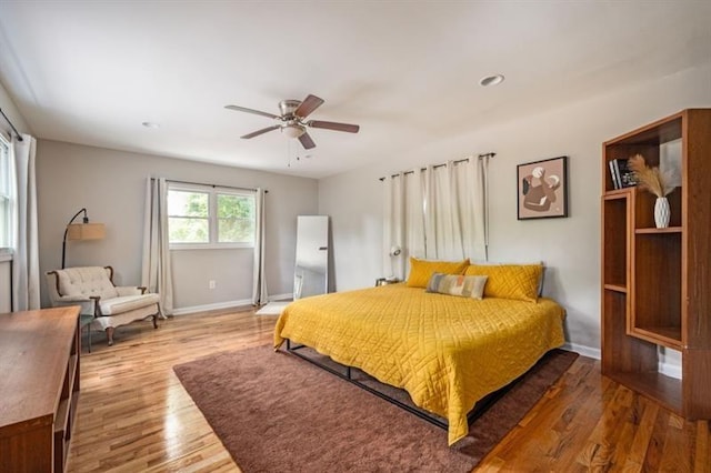 bedroom featuring wood-type flooring and ceiling fan