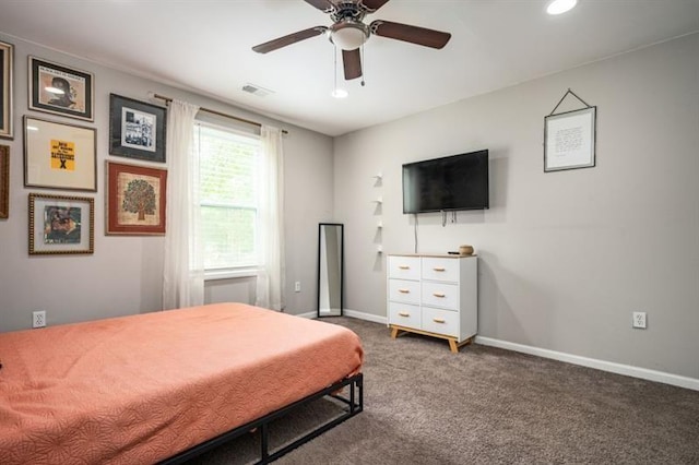 bedroom with ceiling fan and dark colored carpet