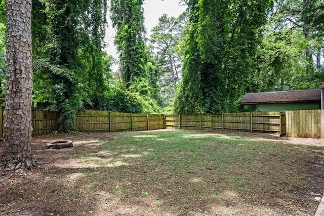 view of yard with an outdoor fire pit