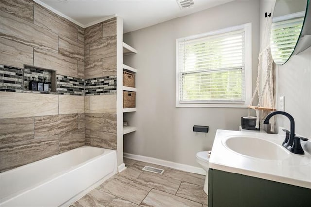 full bathroom with tiled shower / bath combo, vanity, plenty of natural light, and toilet