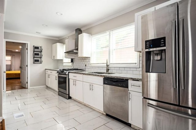 kitchen with sink, dark stone counters, white cabinets, stainless steel appliances, and backsplash