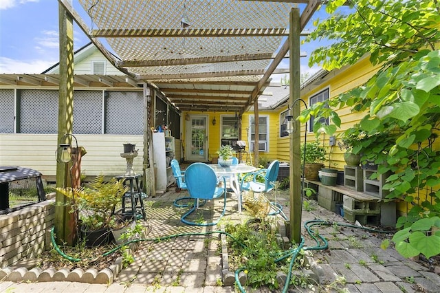 view of patio / terrace featuring a pergola and outdoor dining space