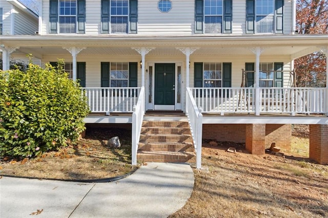 property entrance with covered porch