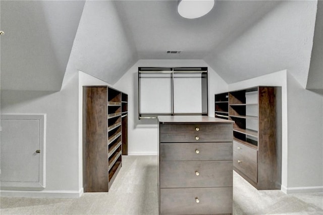 walk in closet with lofted ceiling and visible vents