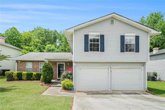 split level home featuring a garage, asphalt driveway, a front lawn, and central AC