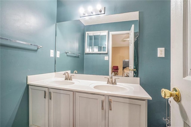 full bathroom featuring double vanity and connected bathroom