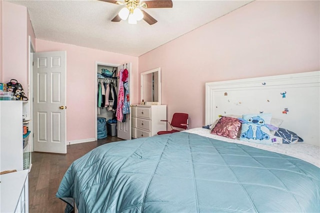 bedroom featuring wood finished floors, a ceiling fan, and a closet