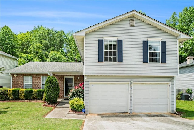 view of front of home featuring an attached garage, concrete driveway, a front yard, and central AC