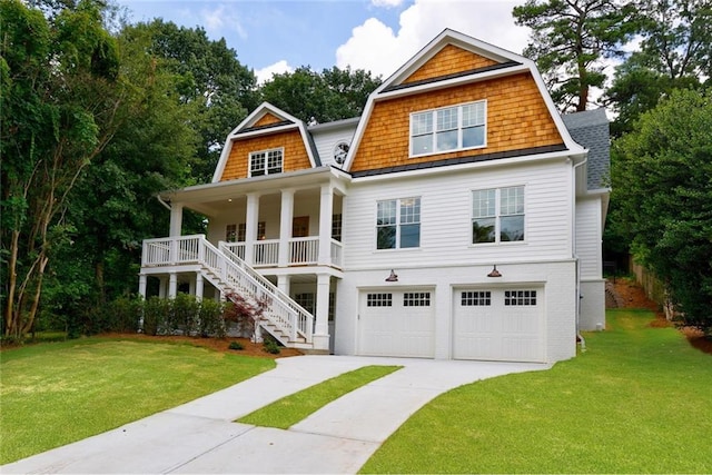 shingle-style home with stairs, a gambrel roof, driveway, and a front yard