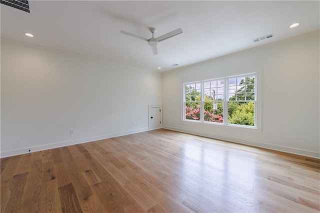 empty room featuring visible vents, baseboards, light wood-type flooring, recessed lighting, and a ceiling fan