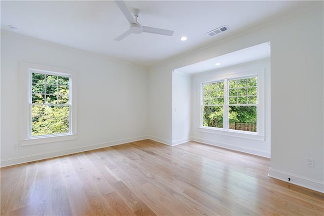 unfurnished room with light wood finished floors, visible vents, ceiling fan, baseboards, and recessed lighting