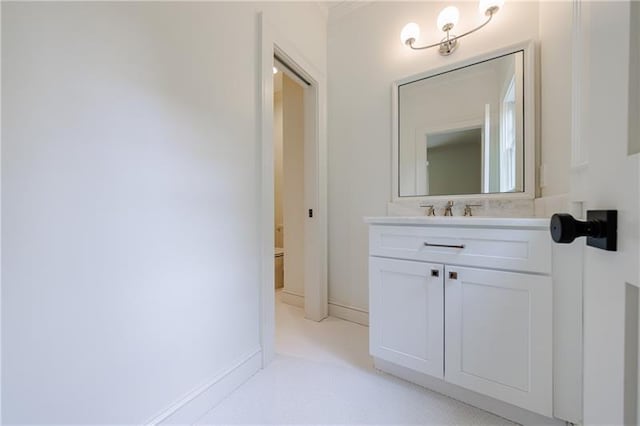bathroom with vanity and baseboards