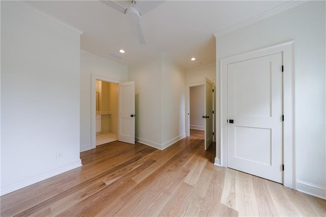 unfurnished bedroom featuring light wood-type flooring, ensuite bathroom, recessed lighting, crown molding, and baseboards