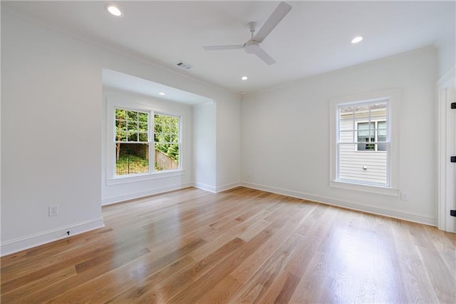 unfurnished room featuring recessed lighting, light wood-style floors, visible vents, and baseboards
