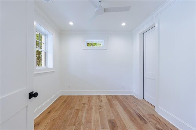 unfurnished room featuring a ceiling fan, baseboards, recessed lighting, light wood-style floors, and crown molding