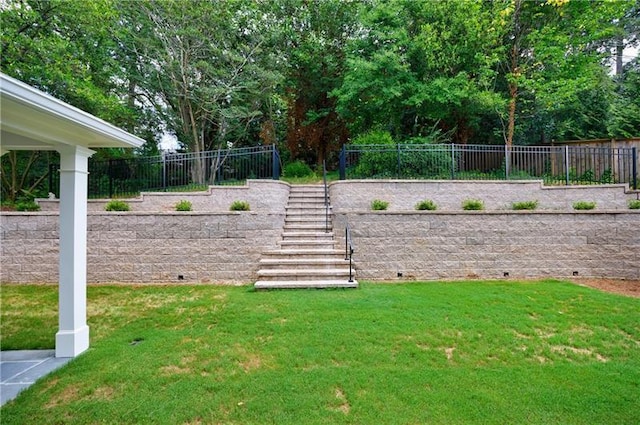 view of yard with stairway and fence