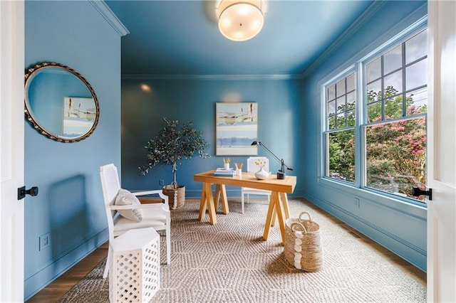 office space featuring wood finished floors, baseboards, and ornamental molding