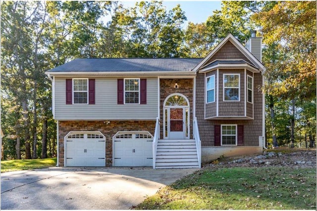 raised ranch featuring a garage