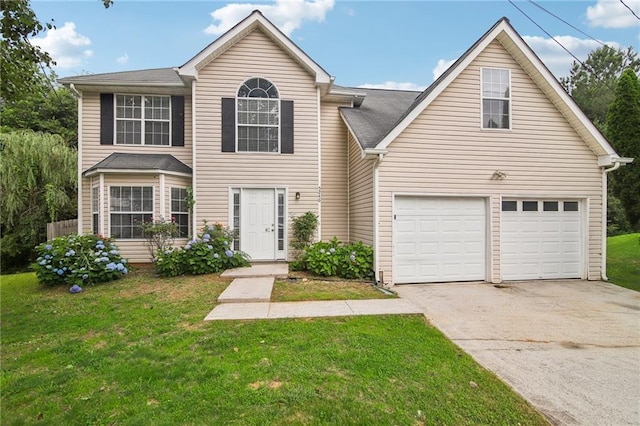 front facade with a garage and a front yard