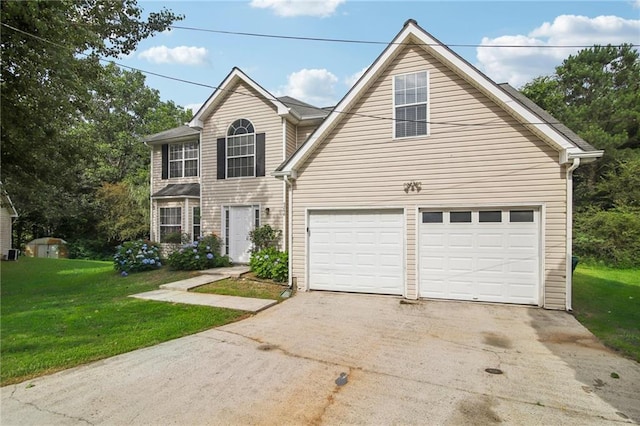 view of property with a garage and a front yard