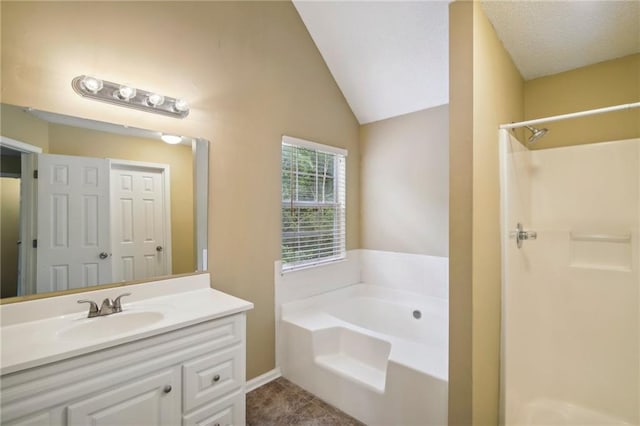 bathroom with vanity, tile patterned flooring, vaulted ceiling, and shower with separate bathtub