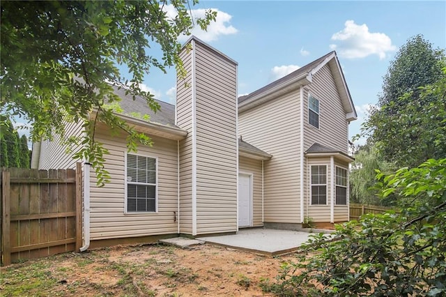 rear view of property with a patio