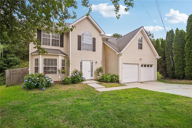 view of front of home featuring a garage and a front yard