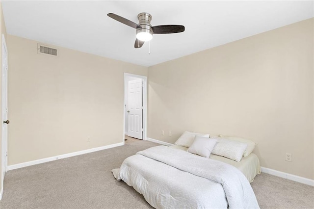 bedroom featuring ceiling fan and light carpet