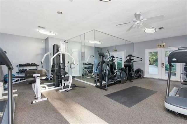 exercise room featuring french doors, ceiling fan, and a textured ceiling