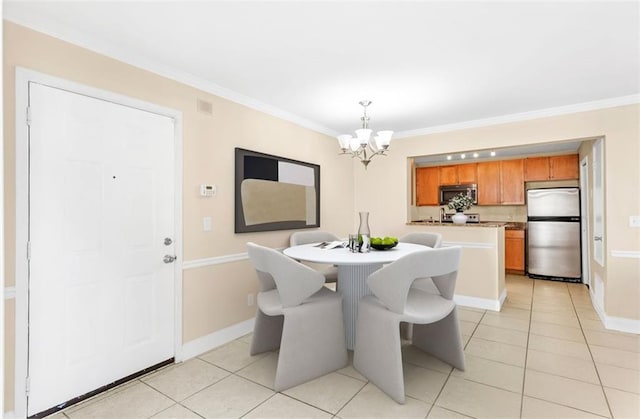 tiled dining room featuring ornamental molding and a chandelier