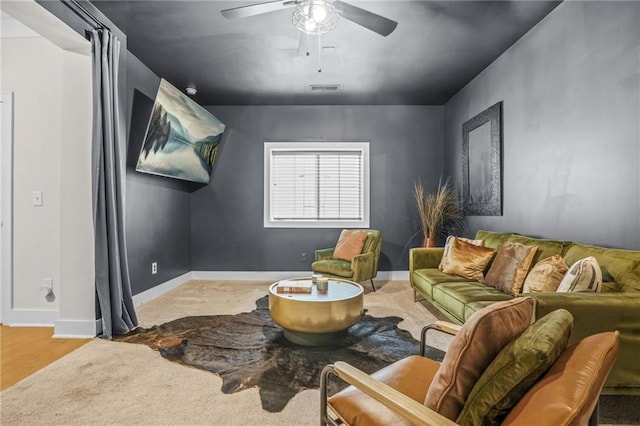 living room featuring a ceiling fan