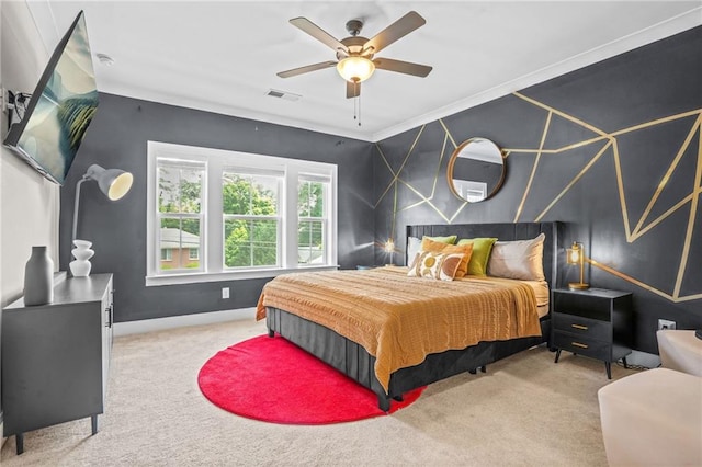 carpeted bedroom featuring baseboards, ceiling fan, and crown molding