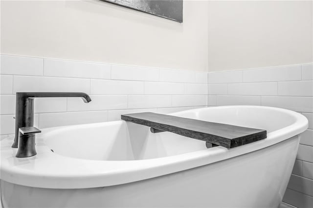 bathroom with tile walls