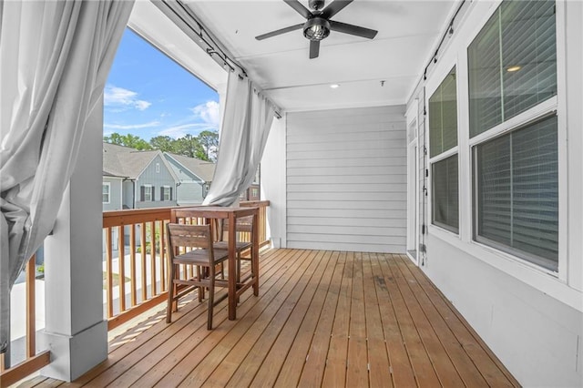 wooden deck featuring ceiling fan and a porch