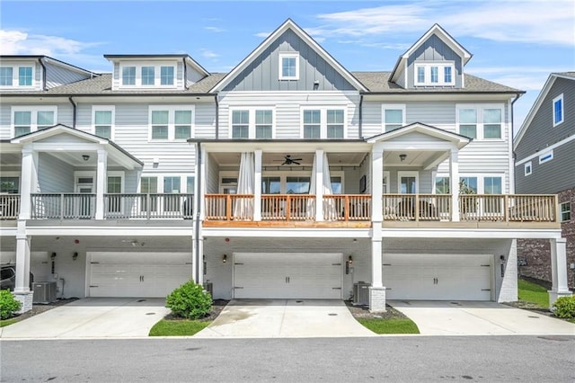 view of front of home with an attached garage, board and batten siding, and concrete driveway