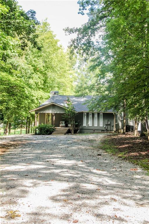 2161 Sugar Creek Trl, Buckhead, GA 30625 - view of front of home with a porch and driveway