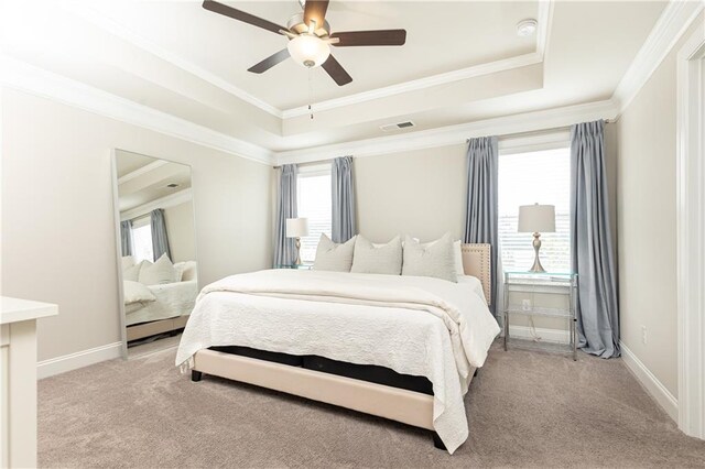 3133 Quinn Pl, Atlanta, GA 30341 - bedroom featuring a raised ceiling, light carpet, crown molding, baseboards, and a ceiling fan