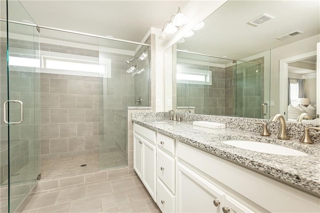 3133 Quinn Pl, Atlanta, GA 30341 - bathroom featuring double vanity, healthy amount of natural light, and a shower stall
