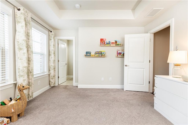 3133 Quinn Pl, Atlanta, GA 30341 - bedroom with light colored carpet, a tray ceiling, and multiple windows