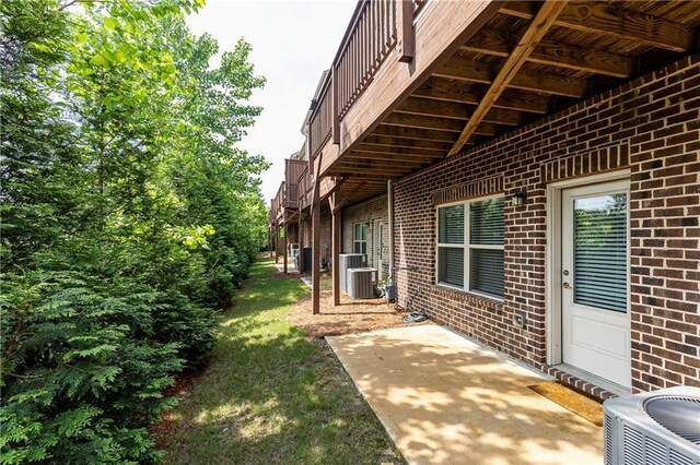 3133 Quinn Pl, Atlanta, GA 30341 - view of grassy yard with cooling unit and a patio