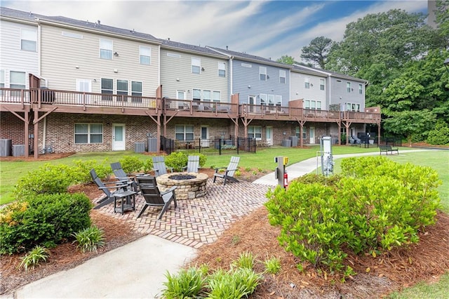 3133 Quinn Pl, Atlanta, GA 30341 - back of property with a fire pit, a yard, a patio, and a residential view
