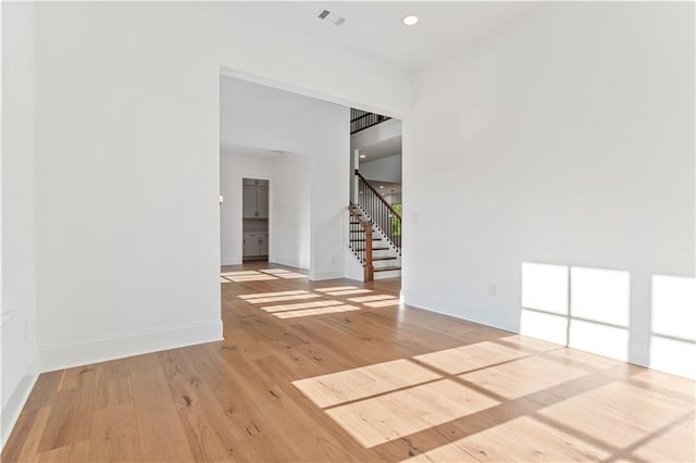 unfurnished room featuring light hardwood / wood-style floors