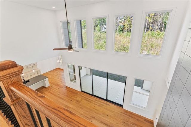 interior space with ceiling fan and hardwood / wood-style flooring