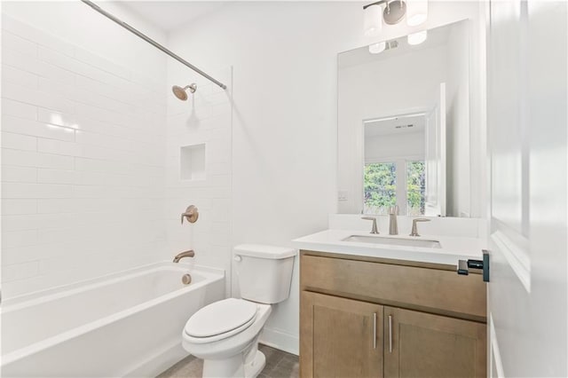 full bathroom with tiled shower / bath combo, vanity, and toilet