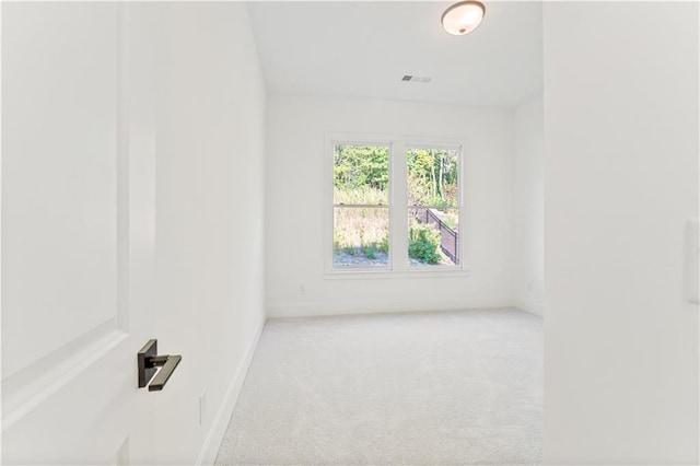 unfurnished room with carpet flooring